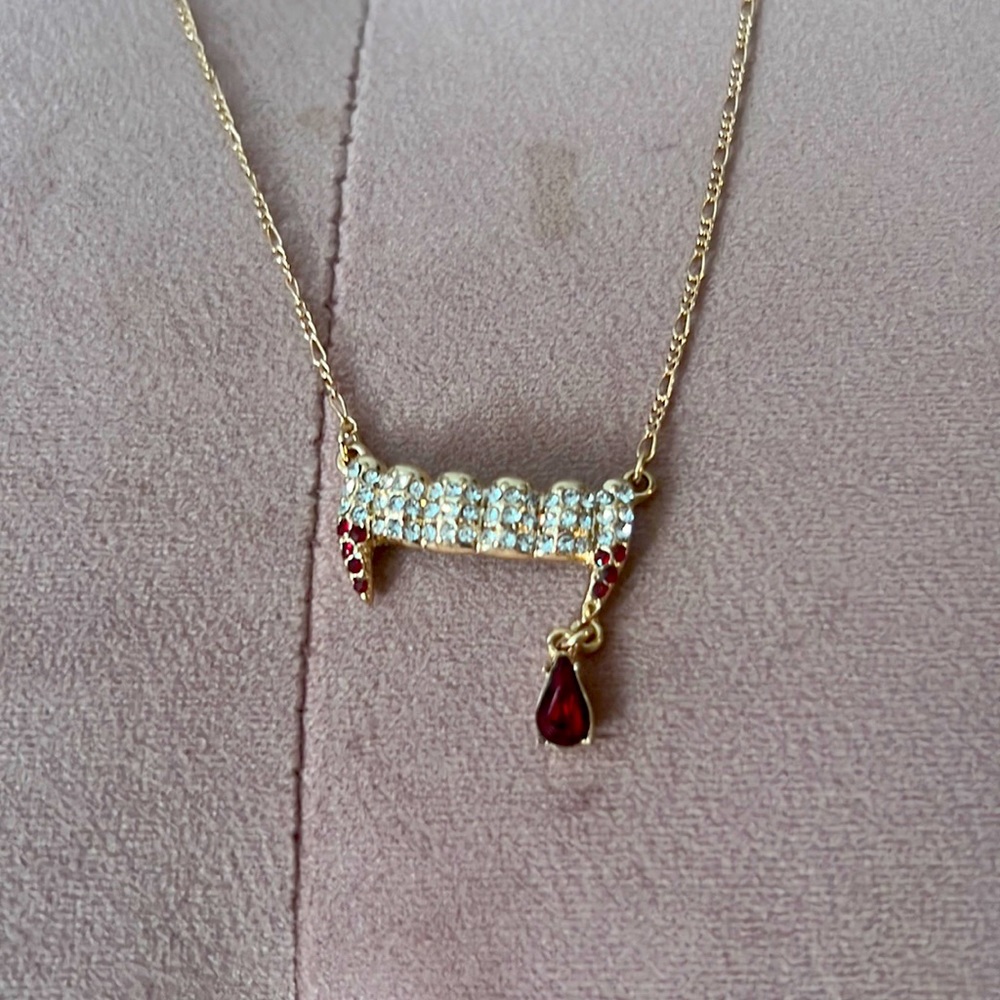 The Vampire’s Wife X H&M vampire teeth necklace